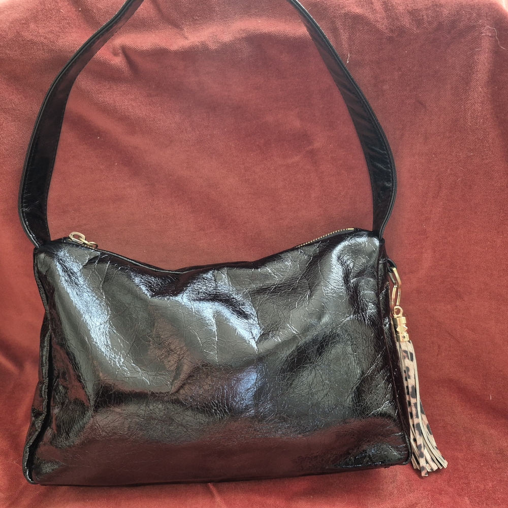 Chic Black Shoulder Bag with Tassel Accent